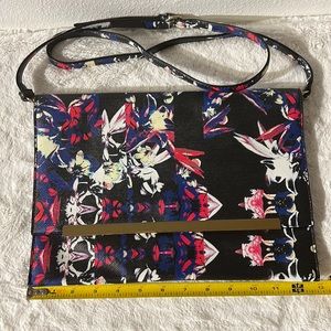 Oversized clutch handbag with strap. Never worn new w/I tags.